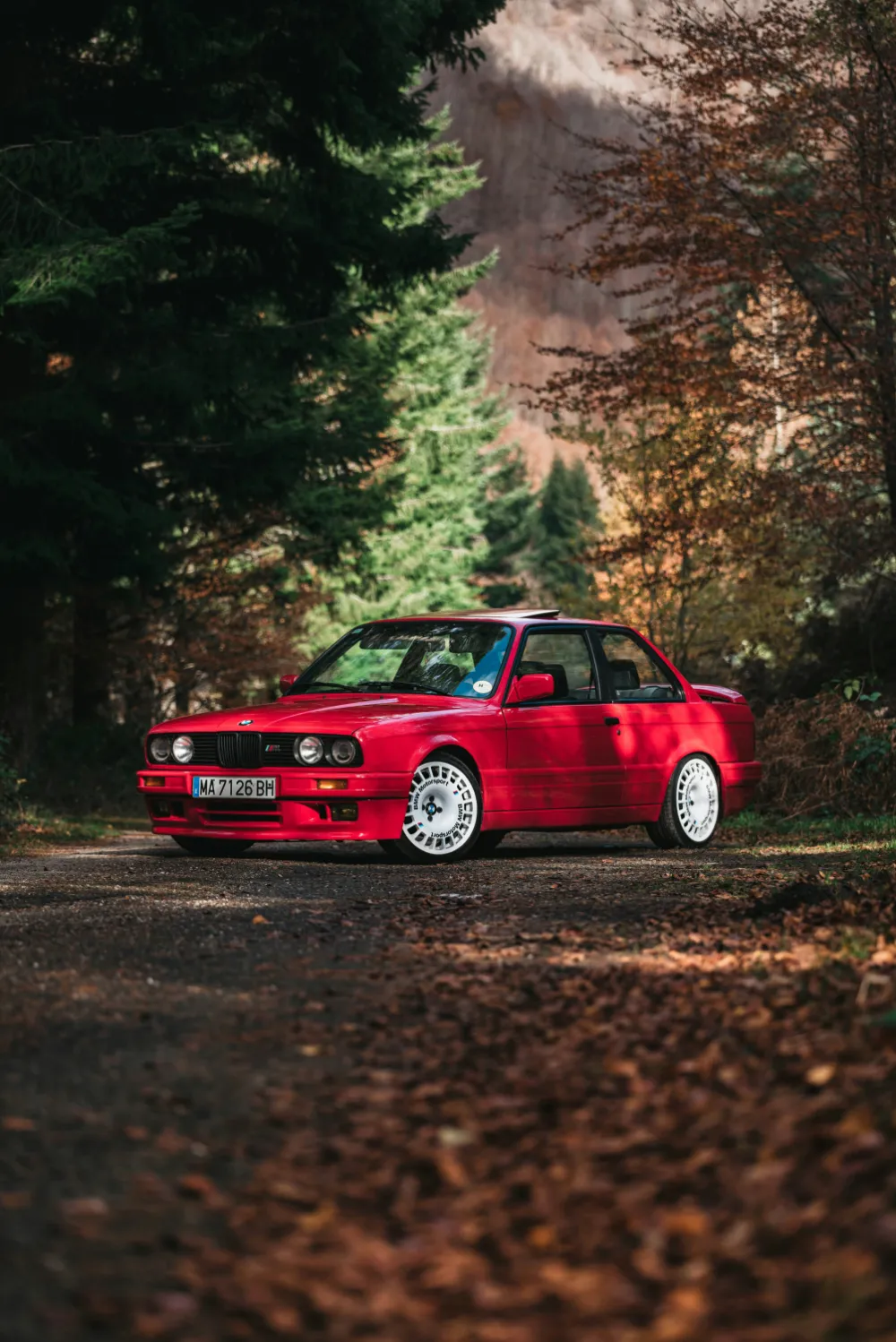Red car img by juan-manuel-sanchez-m_VGbzbpnss-unsplash Red car